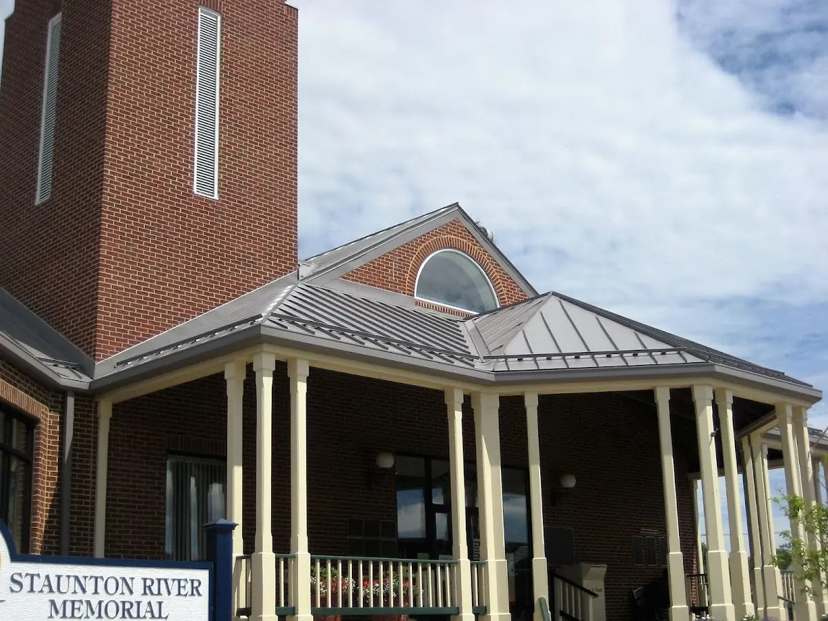 Skilled roofing craftsmen working on a residential roof in Ramseysburg